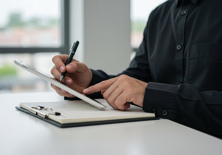 Businessman working on tablet computer at office desk. Business concept.の素材