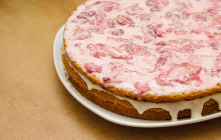 homemade strawberry cake on a platter with natural background
