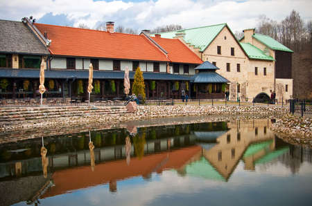 beautiful view of a building and its reflection in the pond in park Belmontas in Vilniusの写真素材