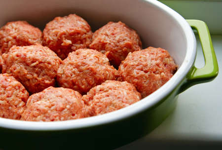 close-up homemade raw cutlets made of beef, pork and riceの写真素材