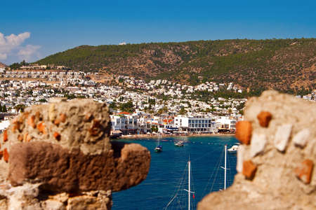view of the Bodrum city in Turkey through the walls of the castleの写真素材