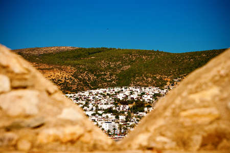 view of the Bodrum city in Turkey through the wall of the castleの写真素材