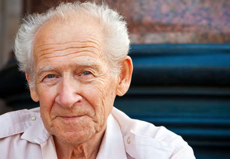face portrait of a cheerful smiling senior man face portrait of a cheerful smiling senior man