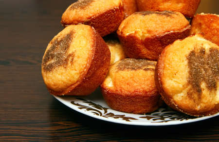 close-up golden muffins on a plate, with apple and cinnamonの写真素材