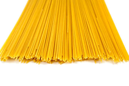 close-up raw pasta isolated on white backgroundの写真素材