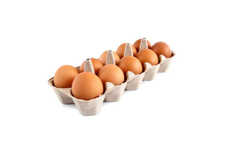 brown eggs in a carton, isolated on white background