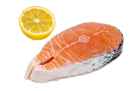 close-up raw salmon and lemon, isolated on white backgroundの写真素材