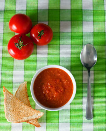 close-up vegetable gazpacho soup served with toastsの写真素材
