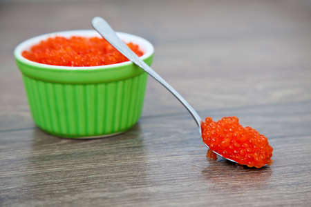 close-up fresh red caviar in the spoon