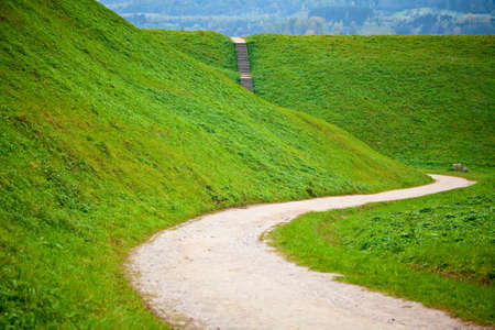 view of hills and stairs in the tourist and archeological village Kernave near Vilnius, Lithuaniaの写真素材