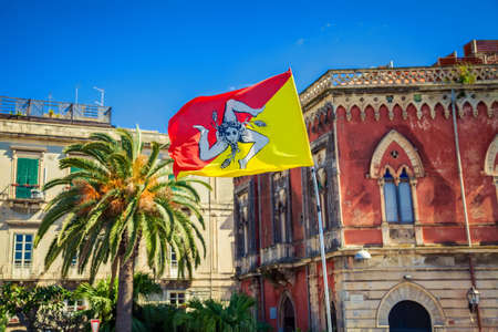 sicilian flag in front of the Syracuse architecture, Sicily, Italyの写真素材