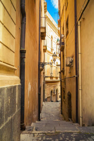 very narrow street of the small town of Sicily, Italyの写真素材