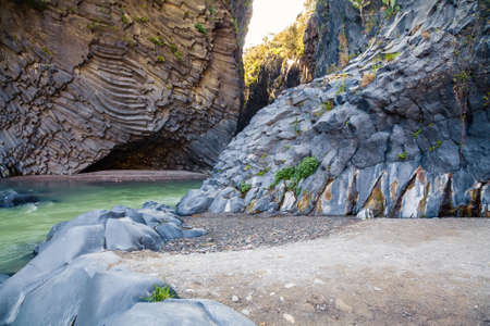 beautiful view with river and unusual rocks at Alcantara Gorge - geological and botanical park at Sicily, Italyの写真素材