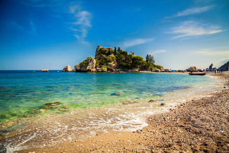 pebble beach in front of the island Isola Bella in Taormina, Sicilyのeditorial素材