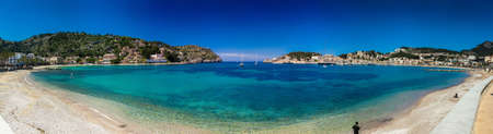 Panoramic view of Port De Soller - a typical mediterranean port with a beach in Mallorca island,...