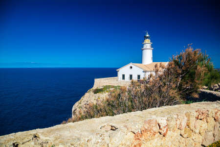 white lighthouse Cala Ratjada, Majorca, Spainの写真素材