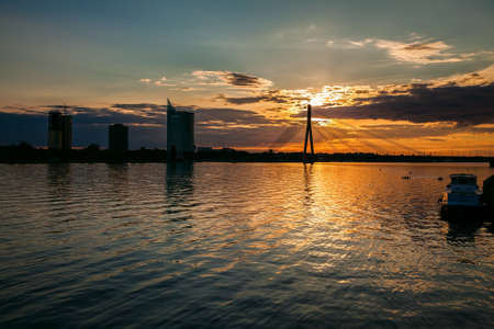 beautiful sunset over the river Daugava in Riga, Latviaの写真素材