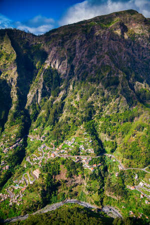 winding roads and small houses in the Nun's Valley, Madeira island, Portugalの写真素材