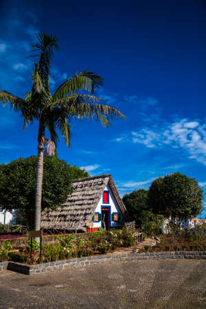 traditional triangular Madeira house thatched with strawの写真素材