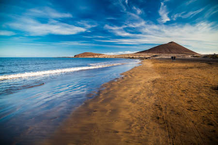 view of Playa el Medano beach with Montana Roja mountain on the background, Tenerife, Canary islands, Spainの写真素材