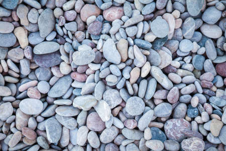 natural background with dry rounded pebbles on the beachの写真素材
