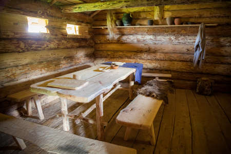 dining room in the ancient wooden peasant hutの写真素材