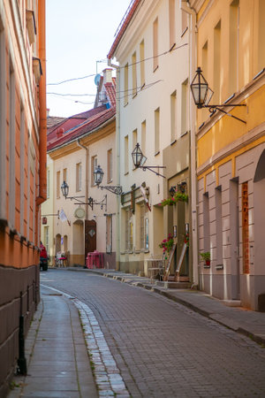 Cozy narrow empty Stikliu street in the Old town in Vilnius, Lithuania. There are a lot of small shops, hotels, bars and restaurants on this street.の写真素材
