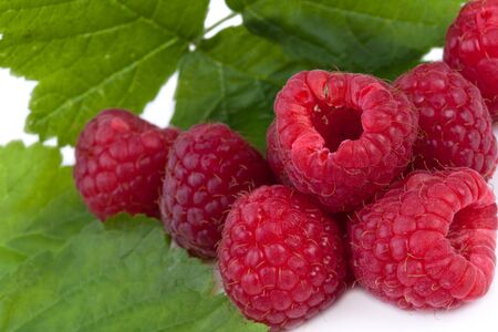 fresh raspberries with leaf on white backgroundの写真素材