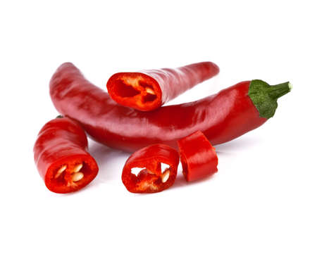cut red hot chili peppers on white backgroundの写真素材