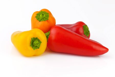 colorful paprika peppers isolated on white background の写真素材
