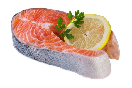 piece of salmon with lemon on white background の写真素材
