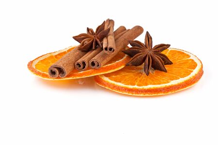 orange slices, cinnamon and anise isolated on whiteの写真素材