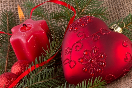 christmas decoration with red heart and candleの写真素材