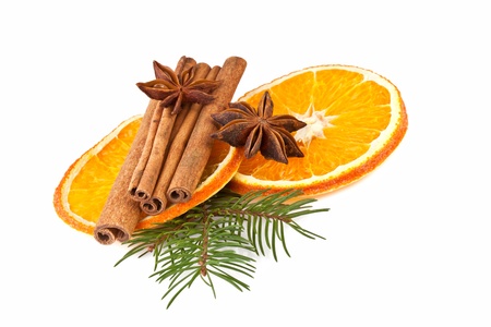 orange slices, cinnamon with fir branch isolated on whiteの写真素材