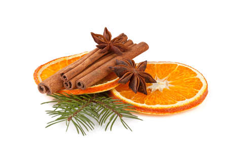 orange slices, cinnamon with fir branch isolated on whiteの写真素材