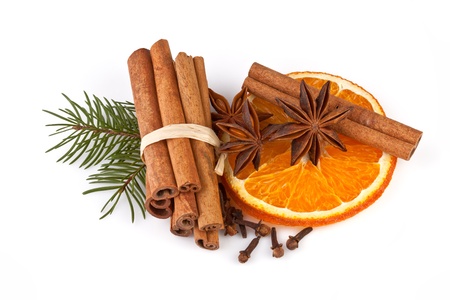 orange sliced, cinnamon with fir branch isolated on whiteの写真素材