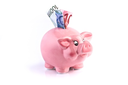 pink piggy bank with euro moneyの写真素材