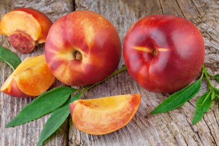 fresh nectarines on wooden  backgroundの写真素材