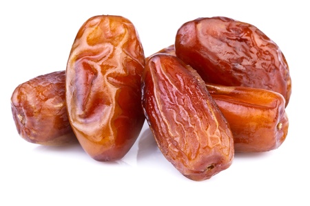  close up of dried dates on white background の写真素材