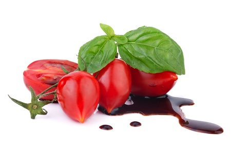 tomato with basil over balsamic vinegarの写真素材
