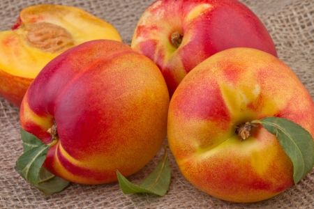 fresh nectarine or peach on wooden  backgroundの写真素材
