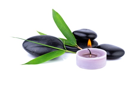 bamboo leaf and zen pebbles, candle over white, spa  conceptの写真素材