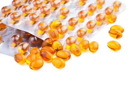 yellow fish oil vitamin pillsの写真素材