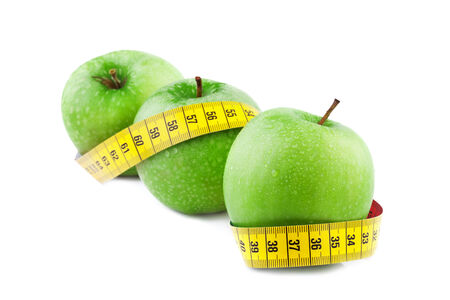Green apple with Measuring Tapeの写真素材