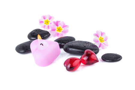 Red Hearts with Spa Stones and burning Candleの写真素材