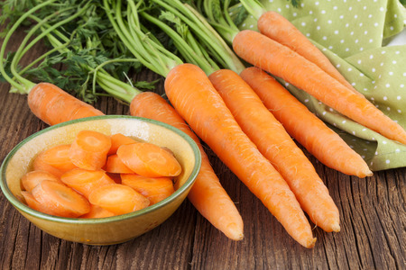 Fresh Carrots on a wooden backgroundの写真素材