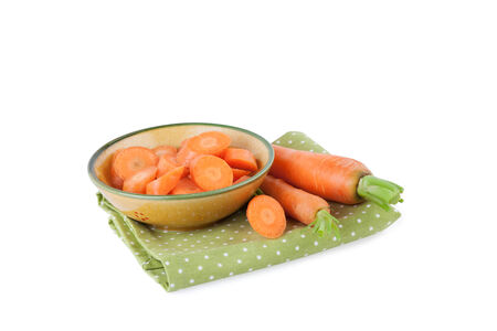 Fresh Carrot on a kitchen napkin isolated on whiteの写真素材
