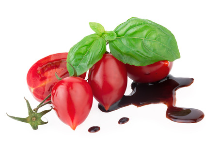 tomato with basil and balsamic over whiteの写真素材