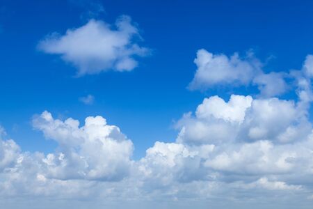 Bright blue sky with white cloudsの写真素材
