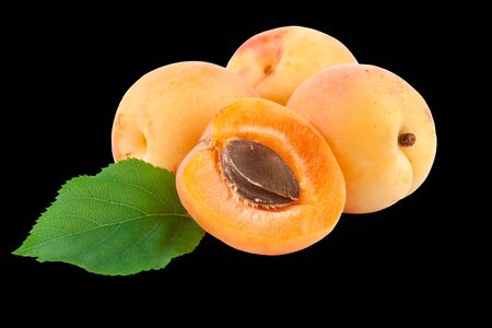 apricots isolated on black backgroundの写真素材